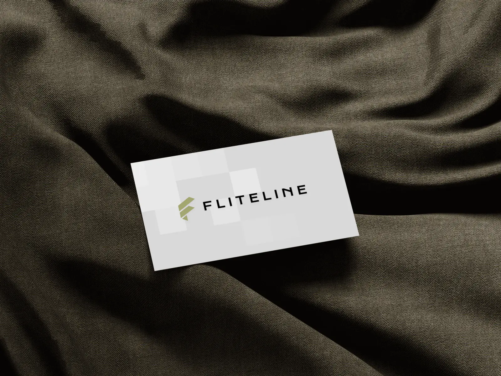 Business cards showing the refreshed Fliteline identity in print.